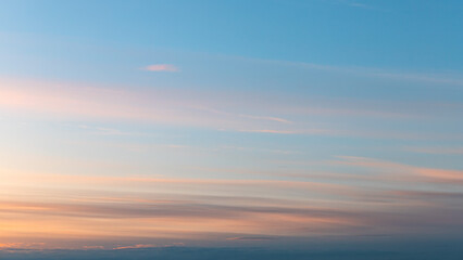 Gentle sky at Sunset or Sunrise time with real pastel clouds, natural colors. real sky and clouds