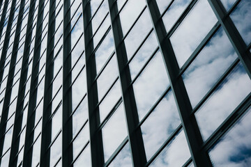 Blue glass background. Office buildind texture. Glass skyscraper background. Glass window construction. Business building pattern. Futuristic architecture. Downtown city center high building.
