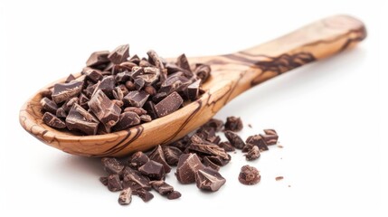 Obraz premium Cacao Nibs in Wooden Spoon Isolated on white background
