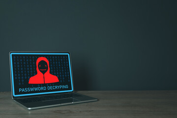 Laptop on table over black background with hacker attention interface on screen idea for cyber attack,cyber security,cyber crime,pishing,hacker.