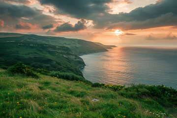 Sunset Over Green Mountains and Ocean &ndash; A Stunning Coastal Landscape Capturing Nature's Dramatic Beauty