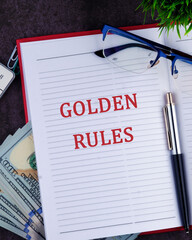 Conceptual golden rule symbol. Copy space. GOLDEN RULES words in a notebook, a vertical photo