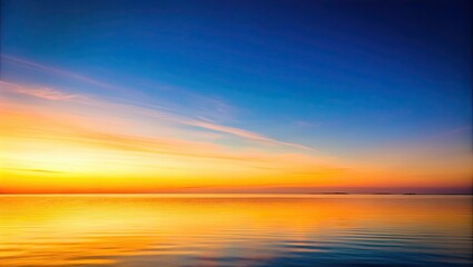 Obraz premium Clear sky background at dawn with gentle orange and yellow hues, clear, sky, background, dawn, gentle, orange, yellow, hues