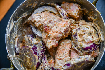 Meat marinating for the shashlik (or shish kebab) in mayonnaise, with onion