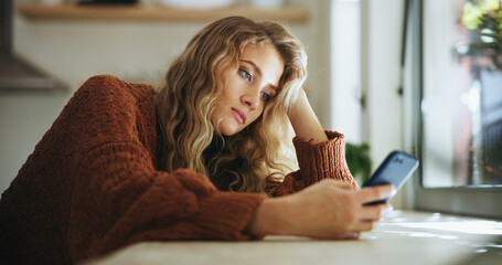 Woman, sad and smartphone in home for reading, chat and message of break up with online partner....