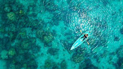Aerial view of a kayak in the blue sea .man kayaking he does water sports activities.  © Media 