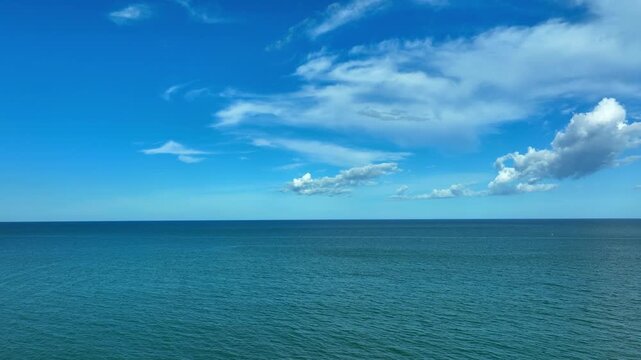 Nature of the beach and sea Summer with sunshine, sandy beaches, clear blue waters sparkling against the blue sky. On an island with good ecology and environment Background for summer vacation concept