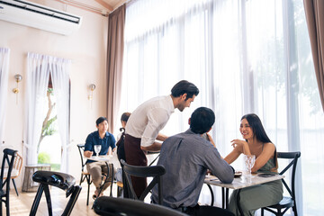 Asian young lovely couple customer having dinner in restaurant together. 