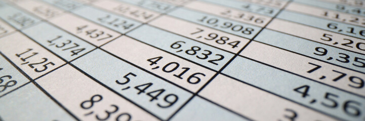 Investigation papers with columns of digits on table