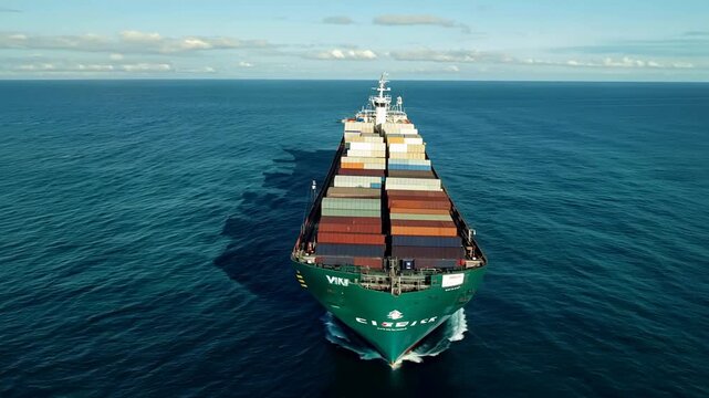 Sea freight is one of the most important engines of the modern economy. Aerial view of a container ship. FHD footage.