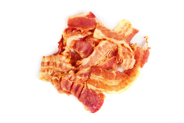 Sliced pieces of dried bacon on a white background in isolation.