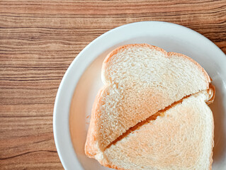 Two perfectly toasted slices of bread, golden brown and crispy on the outside, soft and fluffy on the inside. The perfect way to start a cozy morning.