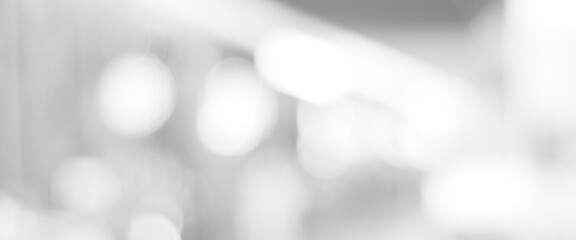Blur white abstract background, blurred grey gradient bright light with copy space backdrop, banner, blank mordern business office interior hallway building design background, monochrome