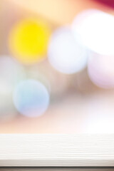Vertical white table presentation, desk and blur background, Empty wood counter, shelf surface over blur restaurant white bokeh background, retail shop, store product display banner, mock up 