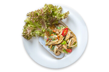 Spicy stir-fried Thai razor clams served on shells on isolate white background.