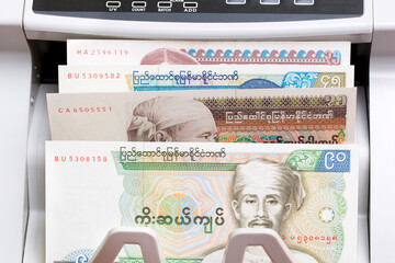 Old Myanmar Kyat in the counting machine