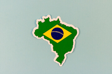 Brazil Map Sticker with National Flag on Light Blue Background with Copy Space.
