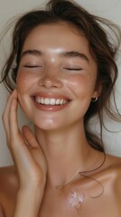 Woman with glowing, flawless skin, smiling and touching her face, clear copy space for ads Bright, clean background emphasizing her radiant complexion