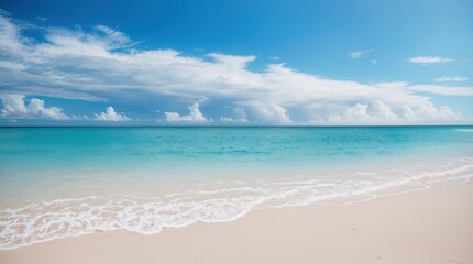 Obraz premium Cyan ocean gently kisses a sandy coastline beneath a serene cloudy sky 