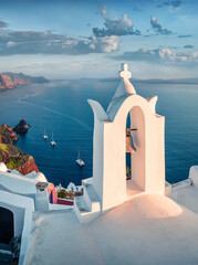 Vertical summer view of Santorini island. Splendid morning scene of famous Greek resort Fira with white bell, Greece, Europe. Traveling concept background. © Andrew Mayovskyy