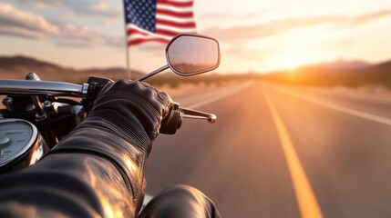 A rider cruising on a motorcycle at sunset with an American flag in the background, capturing the spirit of freedom.