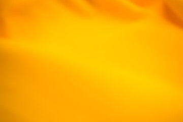 Yellow background blur cloth fabric orange color gradient texture pattern silk wave banner gold, fashion material backdrop poster for summer tropical travel holidays, satin mockup luxury