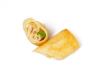 A traditional snack called Sosis Solo, featuring seasoned minced chicken wrapped in a thin flour dough and deep-fried, photographed against a white background.