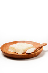 Getuk: a traditional Indonesian snack made from boiled cassava mixed with sugar and grated coconut, then mashed and shaped into flat squares. Photographed on a white background.