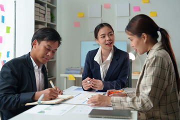 Asian Business people meeting time working with new startup project. Idea presentation, analyze plans. Business Discussing some business ideas. Teamwork concept.