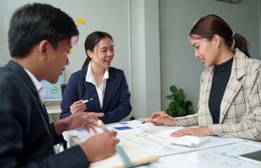Asian Business people meeting time working with new startup project. Idea presentation, analyze plans. Business Discussing some business ideas. Teamwork concept.