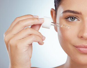 Skincare, face serum and portrait of woman in studio for beauty, natural and hydration routine for...