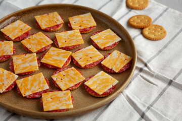 Gourmet Cheese Meat and Crackers on a Plate, side view.