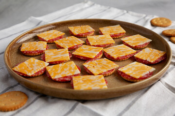 Gourmet Cheese Meat and Crackers on a Plate, low angle view.