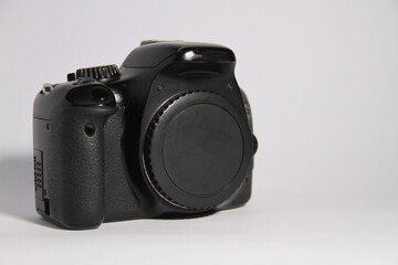 The DSLR camera is black, with a white background.