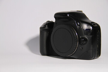 The DSLR camera is black, with a white background.