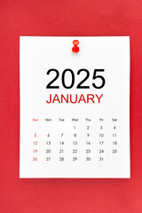 January 2025 calendar page with push pin on red background.