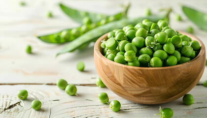 Ripe pods of green peas, fresh green peas in wooden bowl, close up