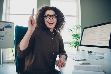 Photo of joyful gald lovely successful woman sit chair create project idea plan work business...