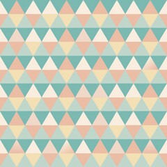 Seamless pattern of tessellating triangles in a spectrum of pastel shades