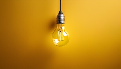 One hanging light bulb on a yellow background,bulb, light, lamp, electricity, energy, idea, power, electric, glass, light bulb, innovation,
