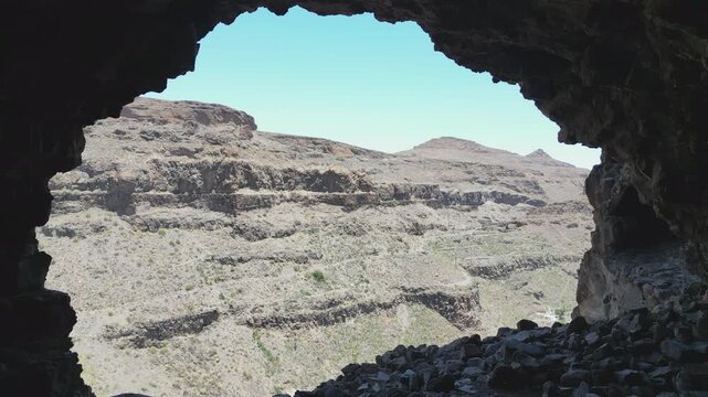 Exploring the cave of the Ansite fortress on the island of Gran Canaria. Canary Islands, Spain.