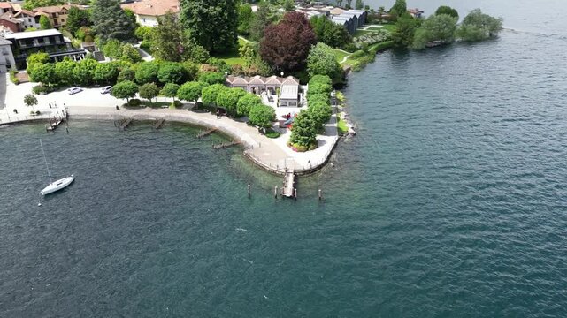 Pella lakeside on Orta Lake in Piedmont region of Italy. Aerial drone orbiting