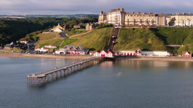Aerial drone view of Saltburn-by-the-sea, Saltburn pier and ocean in Cleveland, North Yorkshire in summer, early morning