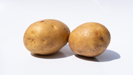 Minimalist Composition of Two Potatoes on White