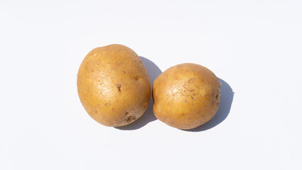 Two Fresh Potatoes on a Clean White Background