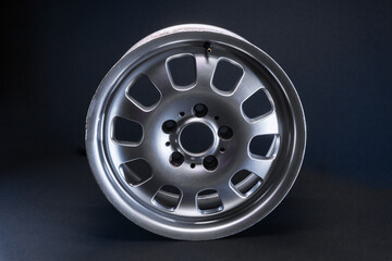 Obraz premium old car wheels titanium rims long exposure video on dark background spinning motion simulation