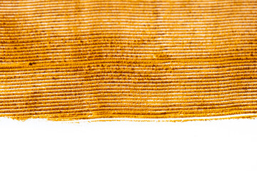 Abstract orange background of spilled turmeric powder on white background top view