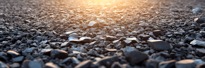 Background of crushed stones in perspective, low view, sunrice