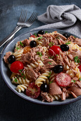 fusilli pasta salad with canned tuna, cherry tomatoes and olives, parmesan, microgreens, homemade, no people,