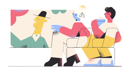 Couple of people sitting next to each other and watching a movie